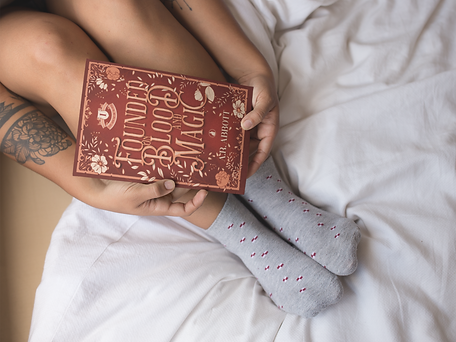 woman-holding-a-book-mockup-near-her-feet-while-in-bed-a17305.png