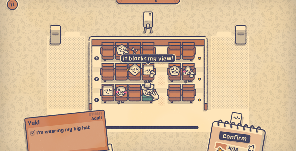 A cinema with people sat down and someone complaining.