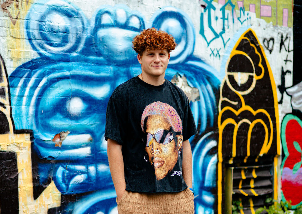 Modern Urban Indianapolis Indiana Male Senior Photo on Graffiti Wall