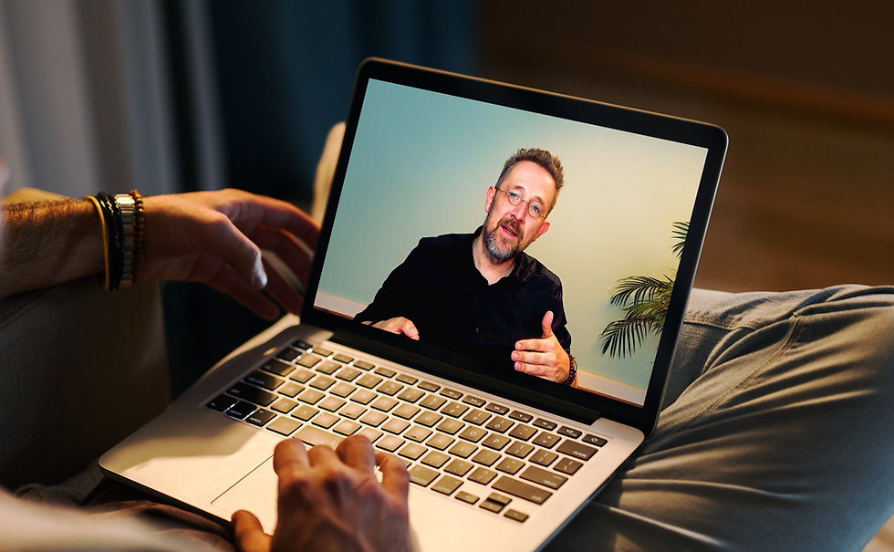 mockup-of-a-man-using-a-macbook-in-a-cozy-living-room-2324-el1 (1).png
