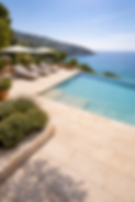 Roman Travertine outdoor paving around swimming pool showing natural stone performance with water exposure