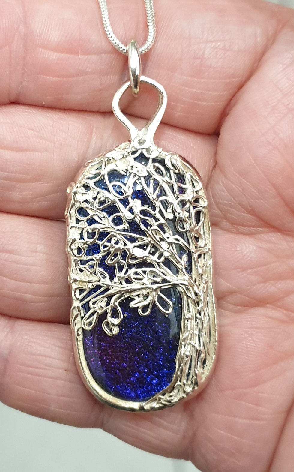 Thumbnail: Silver surround purple oval cabochon with silver tree of life