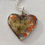 Thumbnail: Heart with orange and yellow flowers