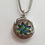 Thumbnail: Large round silver box with multi coloured cabochon inside
