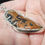 Thumbnail: Silver surround bronze cabochon filigree strands