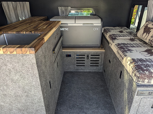 5' Toyota Tundra inside a Four Wheel Campers Project M canopy with a deluxe standup kitchen cargo management system from Fahrt Systems