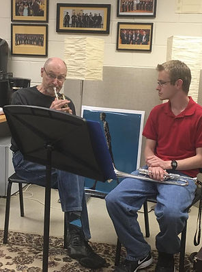 Jesse Baker having a trumpet lessons with Allan Dean at KSU. Allan is demonstrating on the trumept while Jesse observes