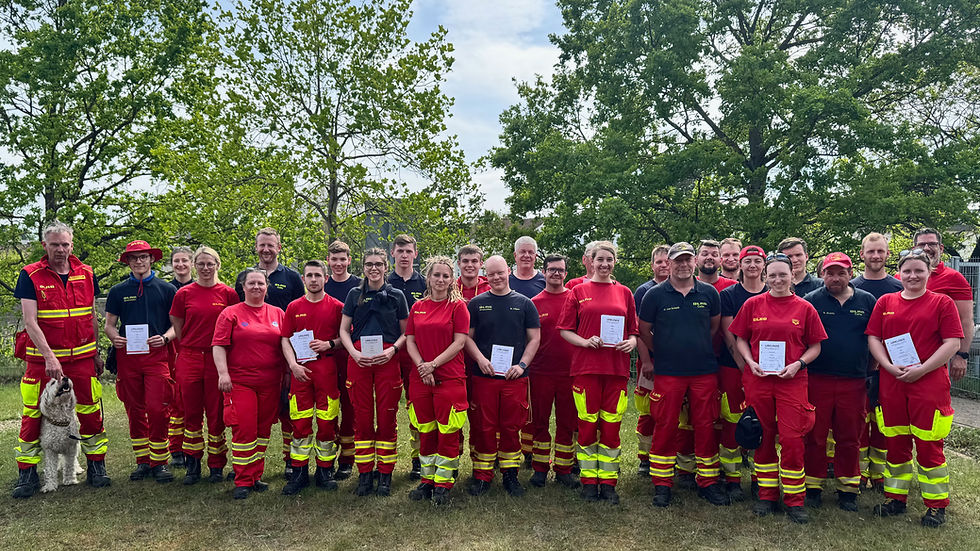 Gruppe in Schutzkleidung