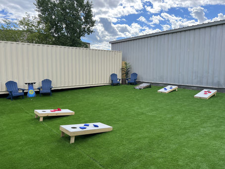 Alternate view of cornhole games in Lumberjack Johnny’s outdoor seating area.