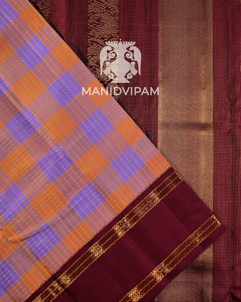 Thumbnail: Korvai Kanjivaram silk saree in a soft pastel peach and lavender checked body