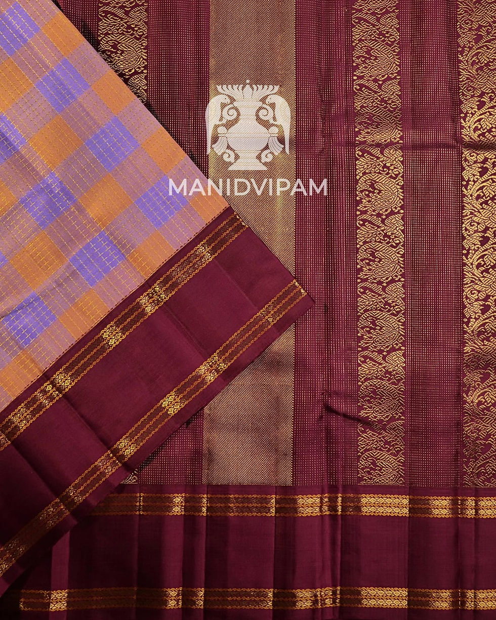 Thumbnail: Korvai Kanjivaram silk saree in a soft pastel peach and lavender checked body