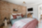 Cincinnati AIRBNB bedroom decorated in a cottage core style with queen sized Leesa mattress.