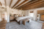 Exposed wood beams in primary bedroom of 1870s Cincinnati AIRBNB.