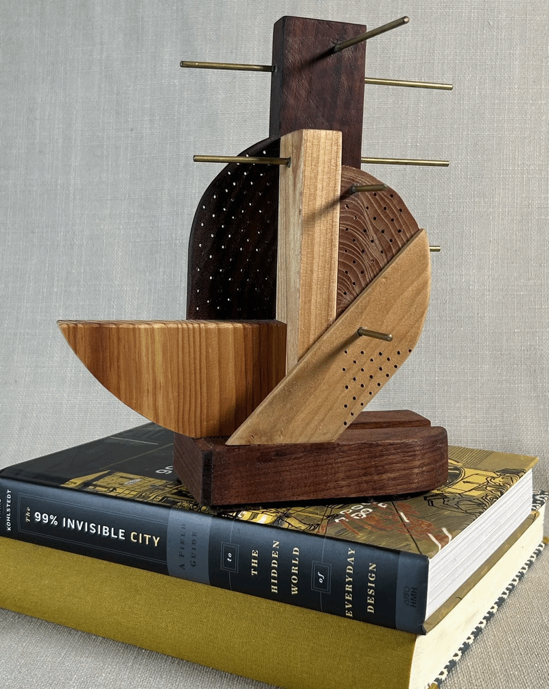 Earring holder made from black walnut, pine, birch, and pomegranate wood