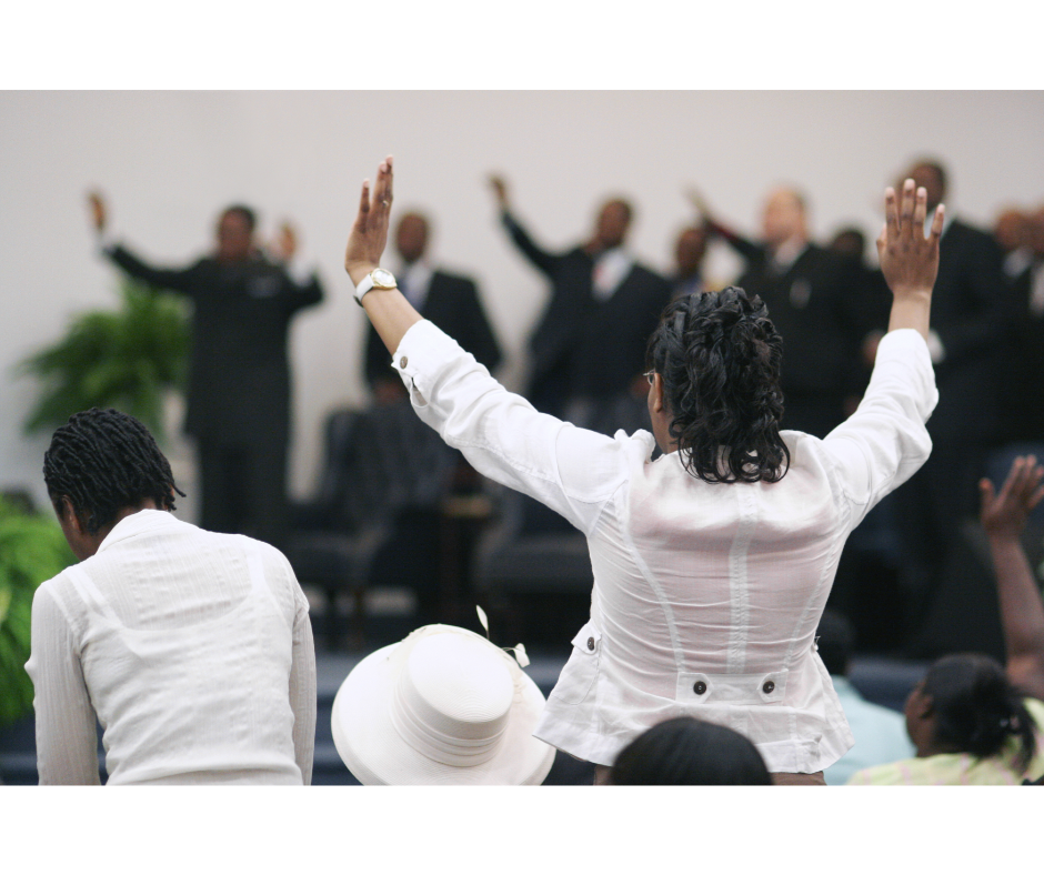 Woman lifting hands in worship inside a church, reclaiming her faith—start your healing with Christian trauma counseling in 60637 today.
