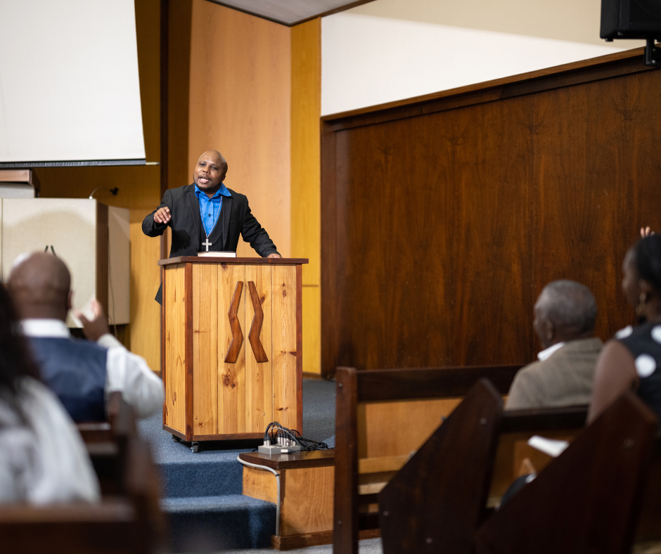 Preacher delivering sermon in church with trauma-informed care, schedule your free strategy call today