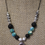 Thumbnail: Aqua Lotus Lava Stone Aromatherapy Necklace