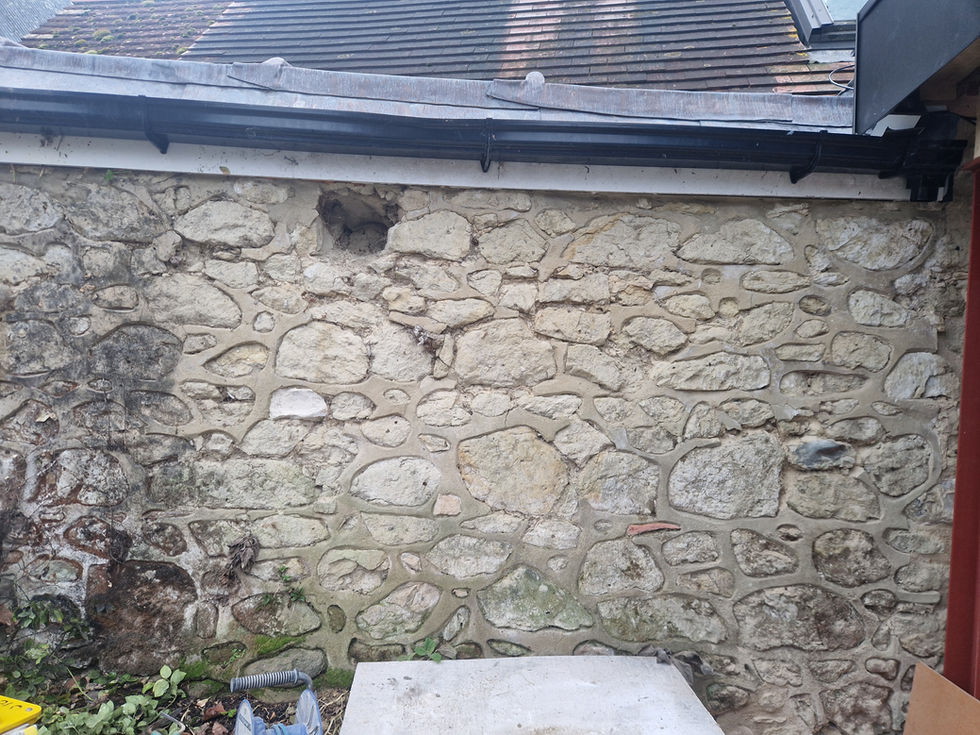Before - Cement based ribbon pointing on soft green sandstone.