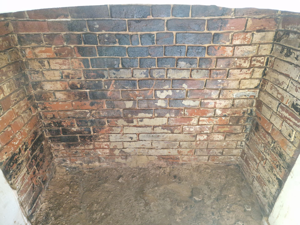 During - Chimney breast cleaned and raked out ready for repoint.