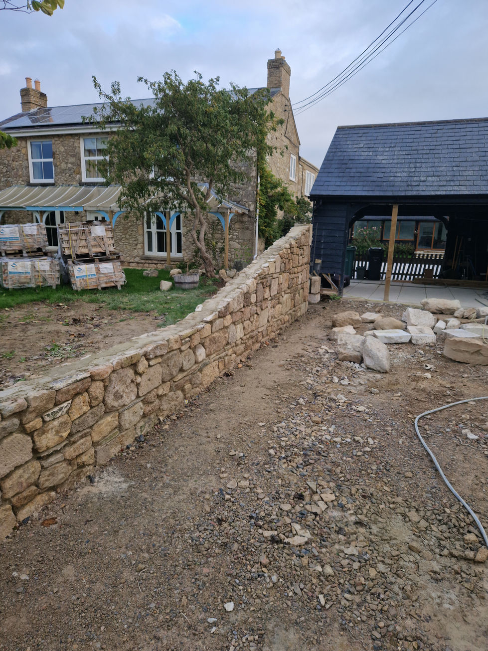 During - Wall raked back to provide privacy but in keeping with local restrictions.