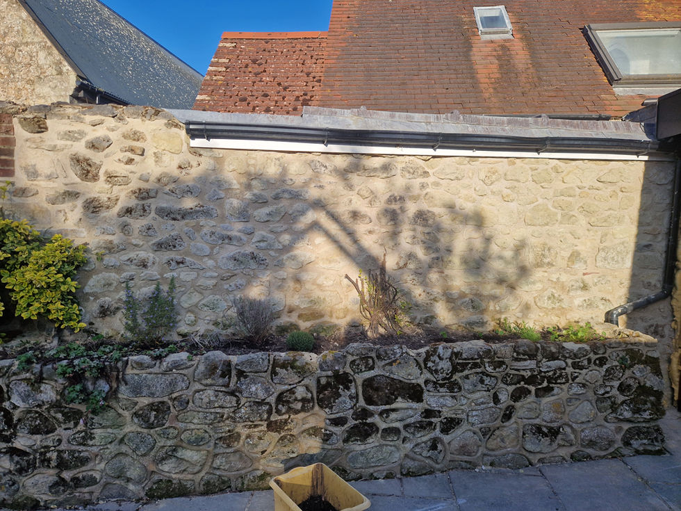 After - Lime repointed and damaged sections repaired.