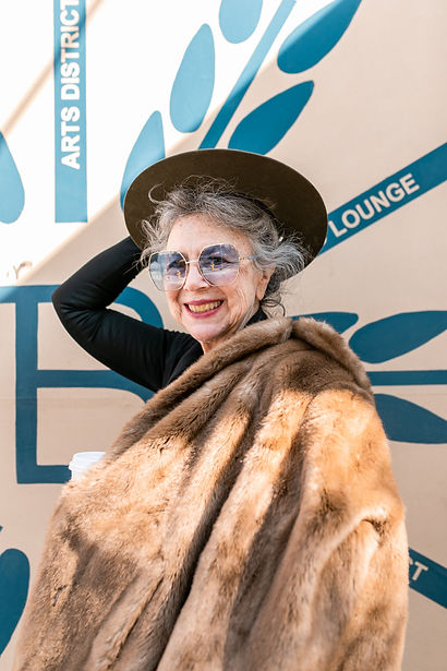 Image of older woman in a fur coat & fedora representing an age class in the market research conducted by The Advocacy Group