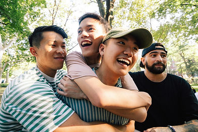 Four young men, huddled up in a photo