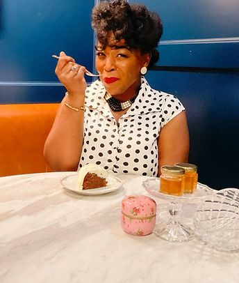 Alisha Smith eating a chocolate cake in a booth at a restaurant