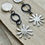 Thumbnail: Silver daisy and hoop ear stud