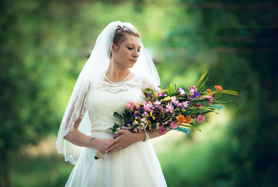 bride holding flowers