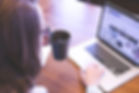 https://www.pexels.com/photo/person-holding-mug-while-using-laptop-7360/