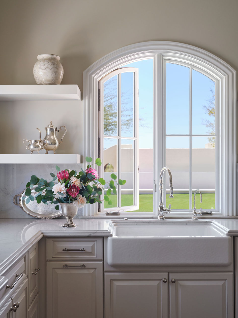 Twin French casement window with dual side-hinged sashes opening outward from the center in a residential home