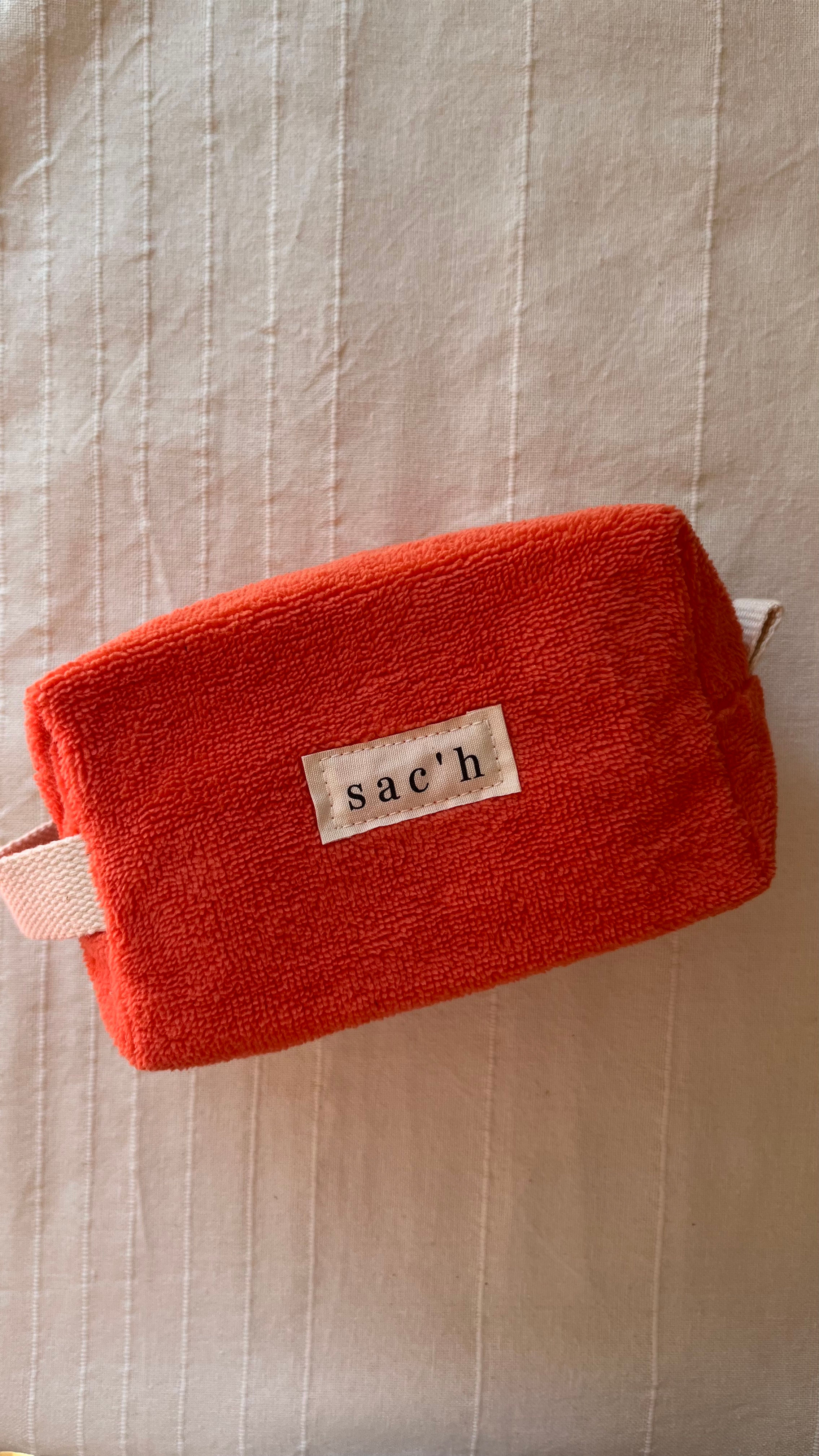 Petite trousse de toilette éponge orange 