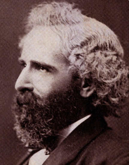 Sepia-toned portrait of a bearded man (Isidor Busch) in a suit facing left. His expression is thoughtful. Oval frame with plain background.