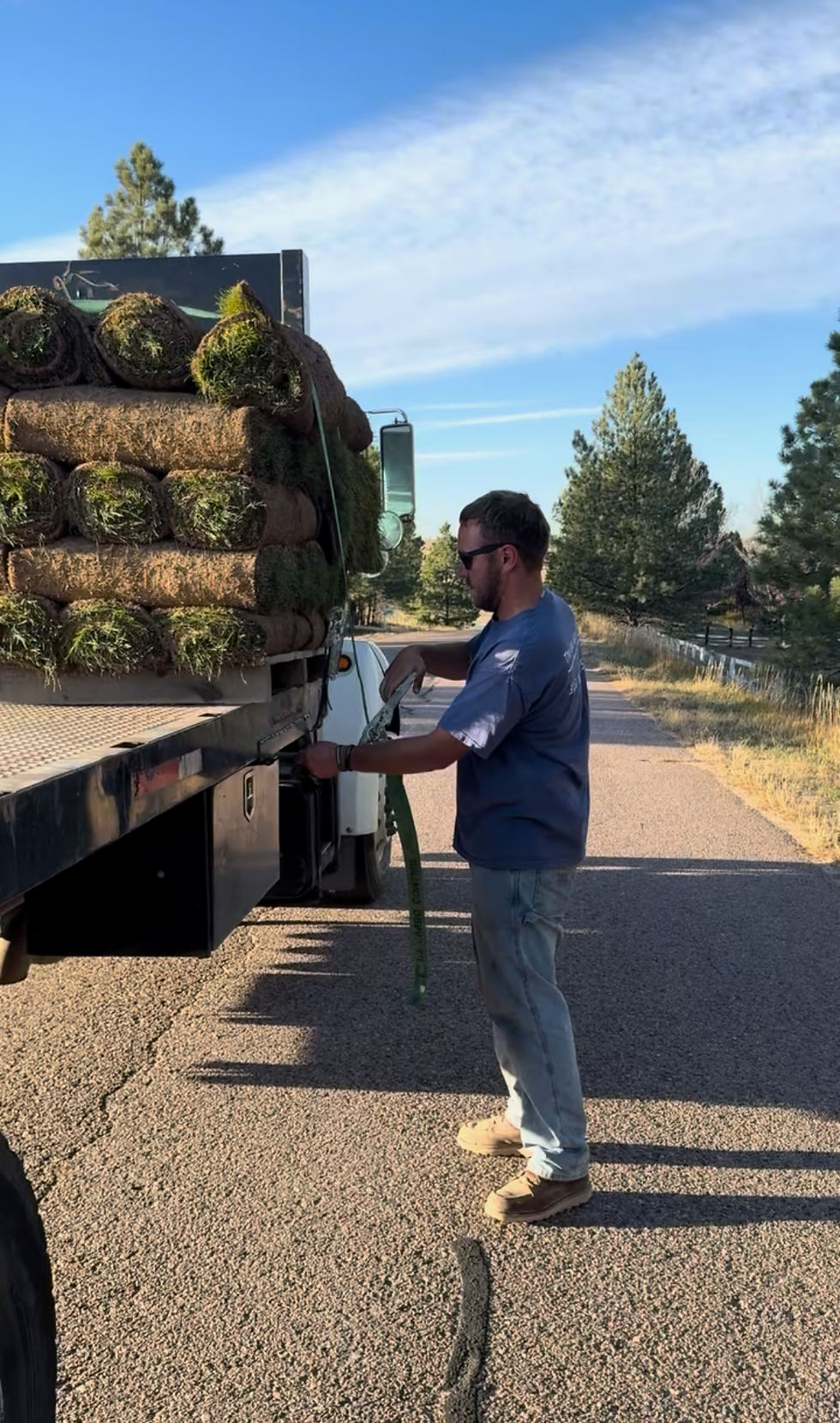 Service professional loading a truck for a business project.