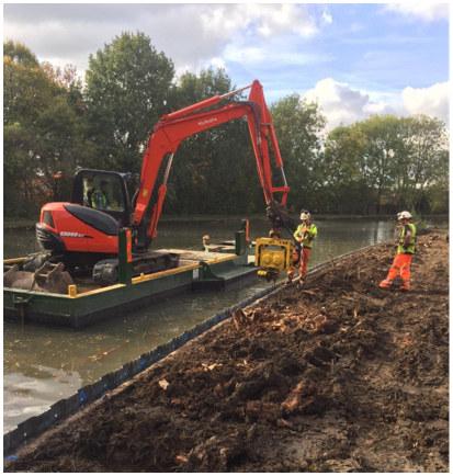 Digger installing pile sheets