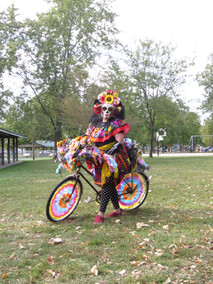 Elegantly spooky bike parade participant