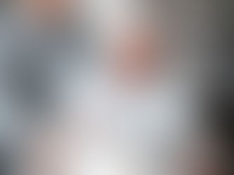 young man helping aged person to use laptop