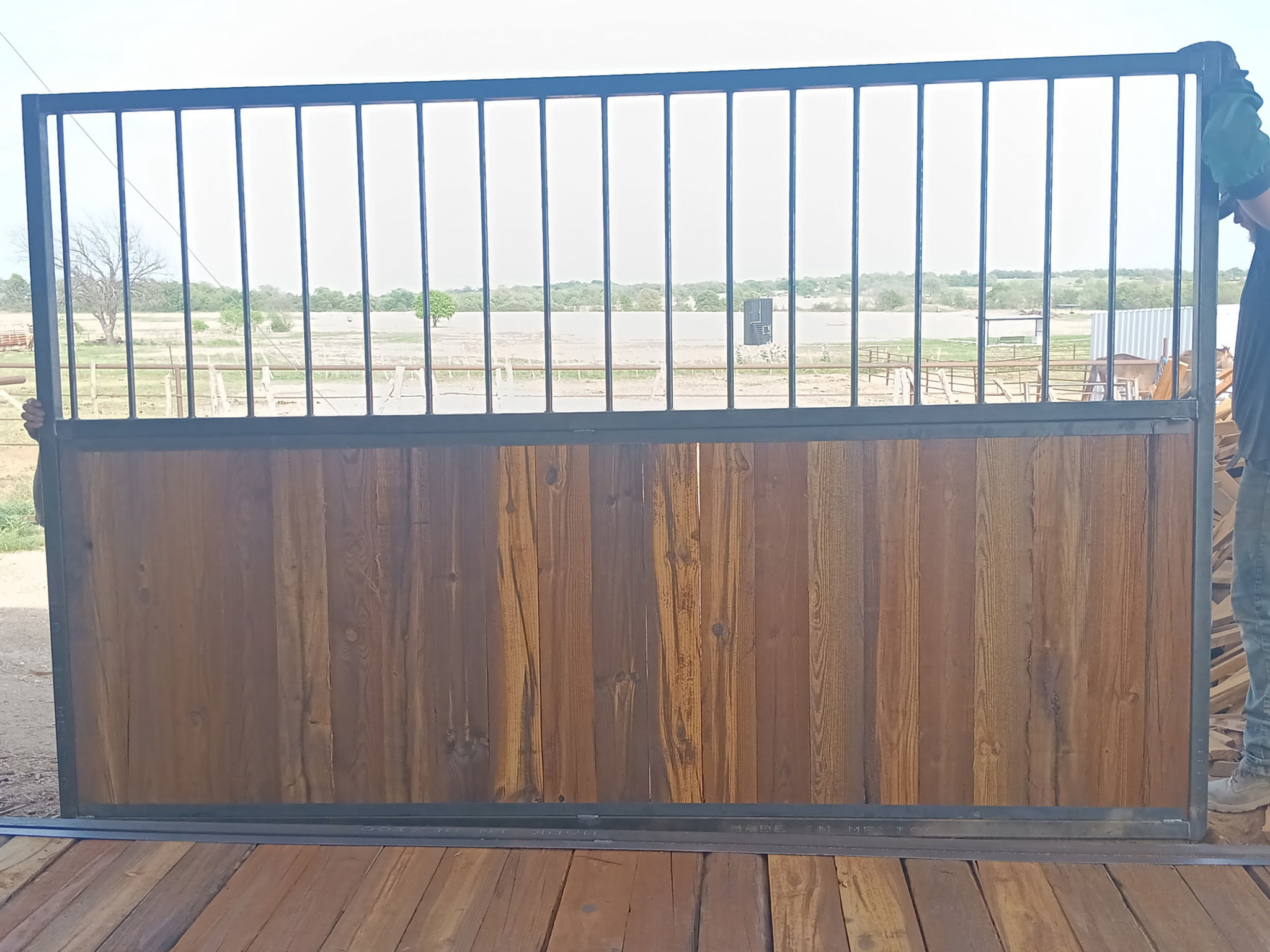 12 foot long 7 tall divider with 4 foot of wood and 3 foot of railing 
