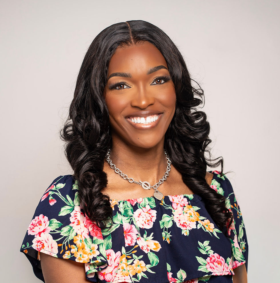 Portrait of the founder smiling, floral dress, neutral background