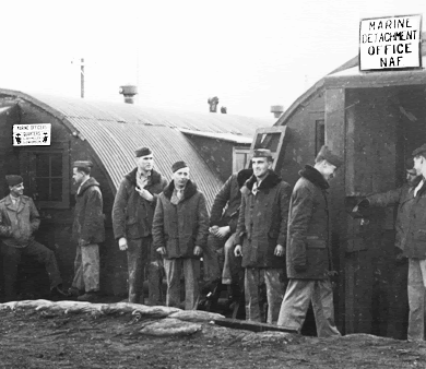 Photo of American Marines in front of their Nissen hut encampment in Iceland. Photo from the Department of Defense (USMC)