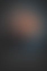 Headshot of male wearing a black polo and black rimmed glasses with blue circle around it and black background with white text reads Aaron Biondolillo Senior Project Manger