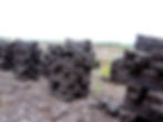 Cut peat stacked to dry in Ireland.