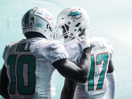 Dolphins' Resilient Spirit Shines Bright: Tyreek Hill and Jaylen Waddle Impress in Thrilling Battle Against Vikings