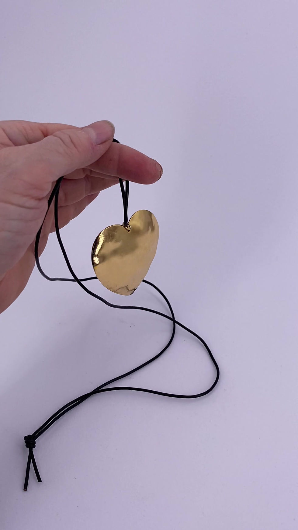 Thumbnail: Hand Hammered Heart Necklace on Black Leather Cord