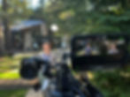 Woman being filmed by a video camera outdoors