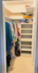 Closet organized with frequently used items on lower shelves and less-used items up high, following