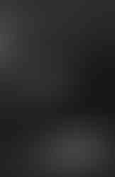 Sand dunes with bright edges and deep shadows at sunset in black and white