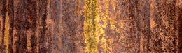 Panoramic abstract photograph of corrosion on an East Houston chemical container with rich rust textures and horizontal composition.