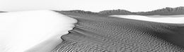 Early morning light on sand dune ridge at White Sands in black and white